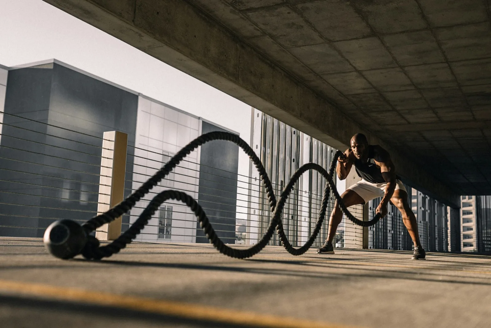 An athlete training with battle ropes