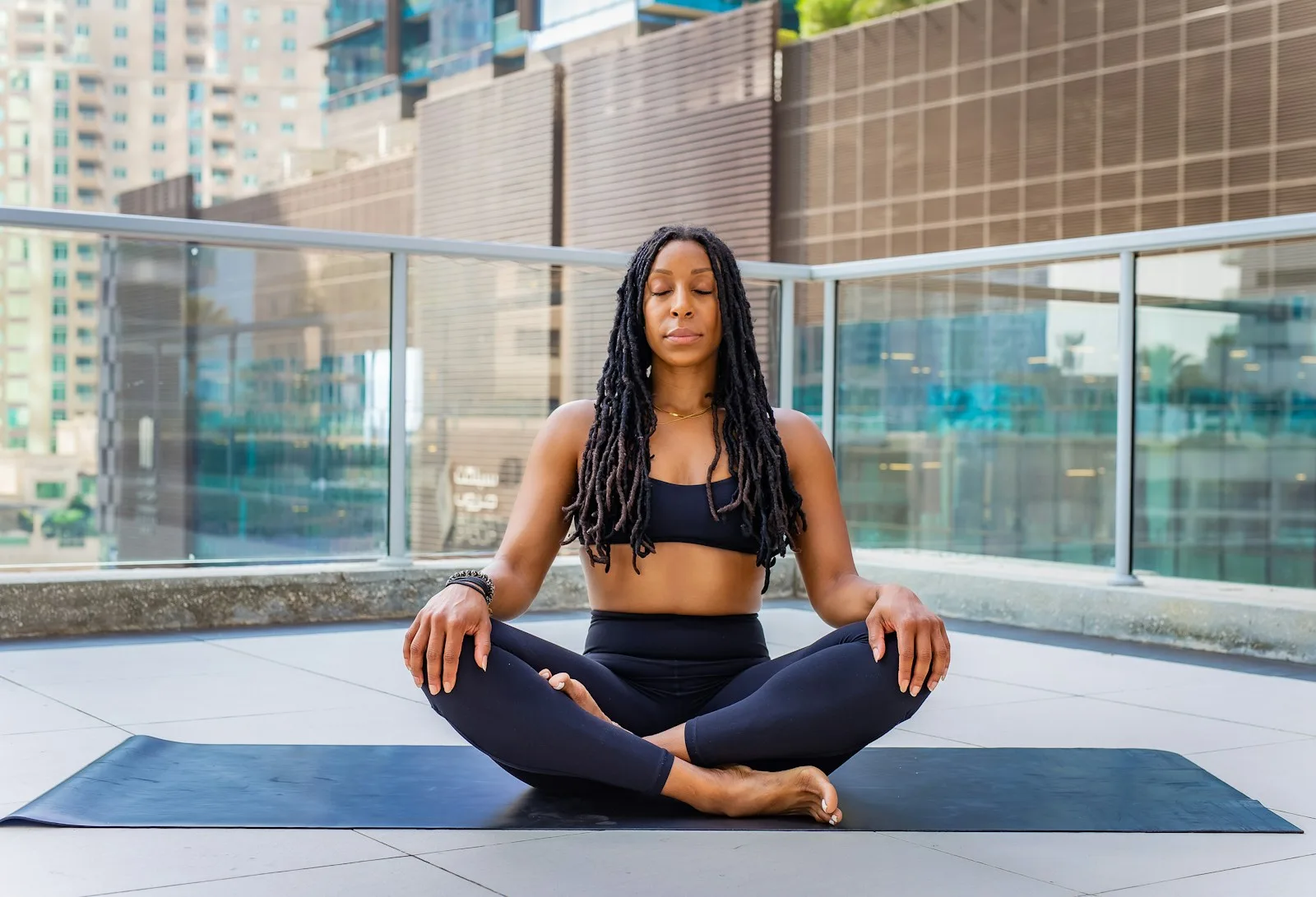 A member meditating on a rooftop